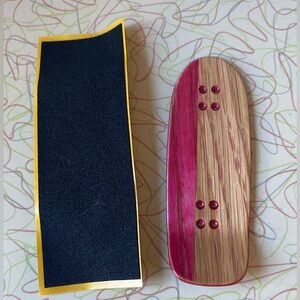 Old school cruiser fingerboard with grip tape